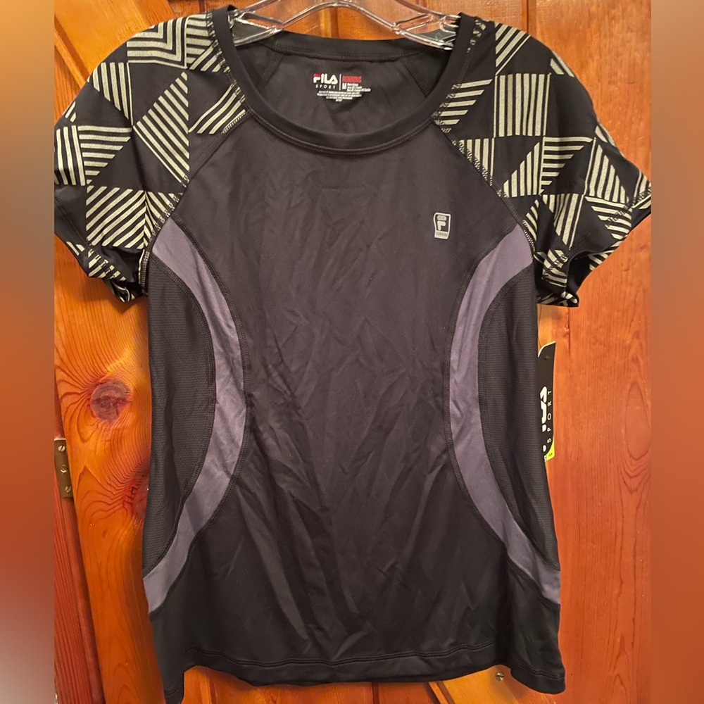 Fila moisture wicking athletic shirt. Women’s medium. New with tags